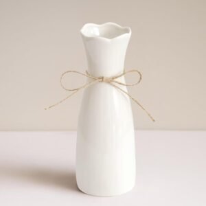 Glossy solid white ceramic bloom holder wrapped with woven detail, sleek elegant minimalist design, fits reed grass arrangements in offices, lounges, mantels and bedrooms