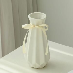 Geometric folded shape ceramic flower vessel with fabric accent, artistic structured design decorative jar for contemporary indoor styling